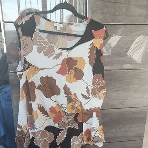 Chic White and Brown Sleeveless Blouse with Artistic Print